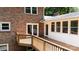 Exterior view of the house showcasing a wooden deck and access to an enclosed sunroom at 2605 Camelot Dr, Rock Hill, SC 29732