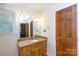 Bathroom with tiled countertop vanity and decorative lighting at 2605 Camelot Dr, Rock Hill, SC 29732