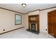Carpeted bedroom with neutral paint and wooden trim with fireplace at 2605 Camelot Dr, Rock Hill, SC 29732