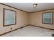 Bedroom with neutral carpet and paint, with two windows that provide natural light at 2605 Camelot Dr, Rock Hill, SC 29732