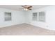Bedroom with neutral carpet and paint, with two windows that provide natural light and a ceiling fan at 2605 Camelot Dr, Rock Hill, SC 29732