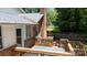 View of a deck featuring lattice railing and a brick chimney, offering a cozy outdoor space at 2605 Camelot Dr, Rock Hill, SC 29732