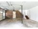 Spacious two-car garage featuring brick walls and plenty of room for storage at 2605 Camelot Dr, Rock Hill, SC 29732