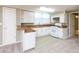 Kitchen with window, white cabinets, and laminate countertop bar at 2605 Camelot Dr, Rock Hill, SC 29732