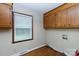 Laundry room with wooden cabinets and flooring with a large window at 2605 Camelot Dr, Rock Hill, SC 29732