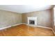 Cozy living room features hardwood floors and fireplace, perfect for relaxing at 2605 Camelot Dr, Rock Hill, SC 29732
