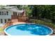 Backyard pool view highlighting the large in-ground pool and wooden deck with access to the main house at 2605 Camelot Dr, Rock Hill, SC 29732