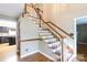 Elegant staircase with hardwood steps and white risers at 2605 Camelot Dr, Rock Hill, SC 29732
