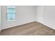 Bedroom featuring neutral carpet, one window, and a closet at 2618 Mt Holly Huntersville Rd, Charlotte, NC 28214