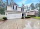 Charming two-story home features a two-car garage, manicured bushes, and black shutters at 2618 Mt Holly Huntersville Rd, Charlotte, NC 28214