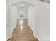 Hallway view showing wood floors, a hallway, and a view to an open living area at 2618 Mt Holly Huntersville Rd, Charlotte, NC 28214