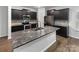 Modern kitchen boasts stainless steel appliances, granite countertops, and dark cabinets at 2618 Mt Holly Huntersville Rd, Charlotte, NC 28214