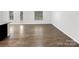 Spacious open floorplan with sleek, continuous hardwood flooring throughout at 2618 Mt Holly Huntersville Rd, Charlotte, NC 28214