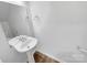 Clean, simple powder room with pedestal sink and ample lighting at 2618 Mt Holly Huntersville Rd, Charlotte, NC 28214