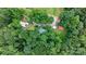 Aerial view of a home nestled among lush greenery, showcasing its secluded and natural setting at 2951 Evergreen Trl, Vale, NC 28168