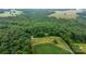 Aerial view of wooded property with a winding driveway, offering a secluded and private setting at 2951 Evergreen Trl, Vale, NC 28168