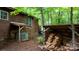 Exterior of wooded home featuring woodpile and AC Unit at 2951 Evergreen Trl, Vale, NC 28168
