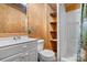 Functional bathroom featuring a vanity, toilet, shower, and convenient built-in shelving at 2951 Evergreen Trl, Vale, NC 28168