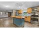 Open concept kitchen featuring a butcher block island, wooden cabinets, and stainless steel appliances at 2951 Evergreen Trl, Vale, NC 28168