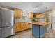 Well-lit kitchen with stainless steel appliances, light wood cabinetry, and a butcher block island at 2951 Evergreen Trl, Vale, NC 28168