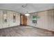 Inviting living room with wood-look flooring, natural light and rustic charm at 2951 Evergreen Trl, Vale, NC 28168