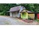 Exterior view of two outbuildings on the property with small details and colorful accents at 2951 Evergreen Trl, Vale, NC 28168