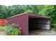 Exterior view of the open sided shed and undergrowth at 2951 Evergreen Trl, Vale, NC 28168