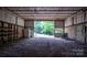 Workshop interior with concrete floor, metal walls, and large opening at 2951 Evergreen Trl, Vale, NC 28168