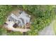 An aerial view shows the house roof and the home's landscaping with mature trees and plantings at 2972 Kaneland Ct, Rock Hill, SC 29732
