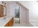Upstairs bathroom with a wooden vanity, marble countertop, and a view into the bedroom creates a clean and airy feel at 2972 Kaneland Ct, Rock Hill, SC 29732