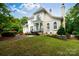 Stately two-story traditional home featuring a manicured front lawn and multiple windows with white shutters at 2972 Kaneland Ct, Rock Hill, SC 29732