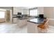 Well-lit kitchen featuring dual islands, light countertops, and white cabinetry at 2972 Kaneland Ct, Rock Hill, SC 29732