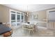 Sunny kitchen features breakfast nook with white wood table, plantation shutters, and tan walls at 2972 Kaneland Ct, Rock Hill, SC 29732