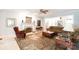 Bright living room featuring a fireplace, mantle decor, ceiling fan, and comfortable seating at 2972 Kaneland Ct, Rock Hill, SC 29732
