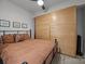 Bedroom featuring a built-in wardrobe, neutral colors, and comfortable bedding at 310 Arlington Ave # 409, Charlotte, NC 28203