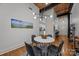 Modern dining area featuring hardwood floors, overhead lighting, and an open floor plan at 310 Arlington Ave # 409, Charlotte, NC 28203