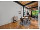 Bright dining area with modern lighting, hardwood floors, and an open connection to the living area at 310 Arlington Ave # 409, Charlotte, NC 28203