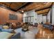 Spacious living area featuring hardwood floors, modern decor, and an open layout at 310 Arlington Ave # 409, Charlotte, NC 28203