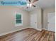 An empty bedroom features wood-look floors and two doors at 317 N Cemetery St, Richfield, NC 28137