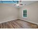 A cozy bedroom featuring wood-look floors and a ceiling fan at 317 N Cemetery St, Richfield, NC 28137