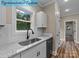 Kitchen area featuring stainless steel appliances, granite countertops, and a backyard view from the sink at 317 N Cemetery St, Richfield, NC 28137