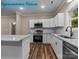 Updated kitchen featuring stainless steel appliances, granite countertops, white cabinets, and wood flooring at 317 N Cemetery St, Richfield, NC 28137