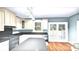 Bright kitchen with stainless steel appliances, center island, and doors to the outside at 317 N Cemetery St, Richfield, NC 28137
