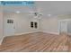 Well-lit living room features sleek hardwood floors and neutral decor, creating a cozy atmosphere at 317 N Cemetery St, Richfield, NC 28137