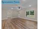 Bright living room showcasing hardwood floors, with natural light and neutral decor at 317 N Cemetery St, Richfield, NC 28137