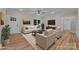 Warm living room featuring hardwood floors and comfortable seating, virtually staged at 317 N Cemetery St, Richfield, NC 28137