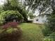 A spacious backyard with verdant lawn and mature foliage, perfect for outdoor enjoyment at 3500 Blessing St, Charlotte, NC 28208