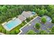 This aerial view shows the community pool, playground, tennis court, parking lot, and surrounding greenery at 362 Windell Dr # 67, Fort Mill, SC 29708