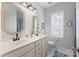 Bathroom with a double sink vanity, wallpapered walls, and a blue rug at 362 Windell Dr # 67, Fort Mill, SC 29708