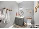 Charming bathroom with round mirror, decorative wall paper, and fresh towels at 362 Windell Dr # 67, Fort Mill, SC 29708